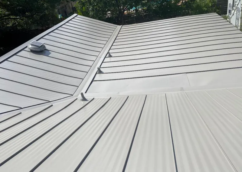 Solar attic fan installed on a metal roof for Roof Ventilation in Cape Coral